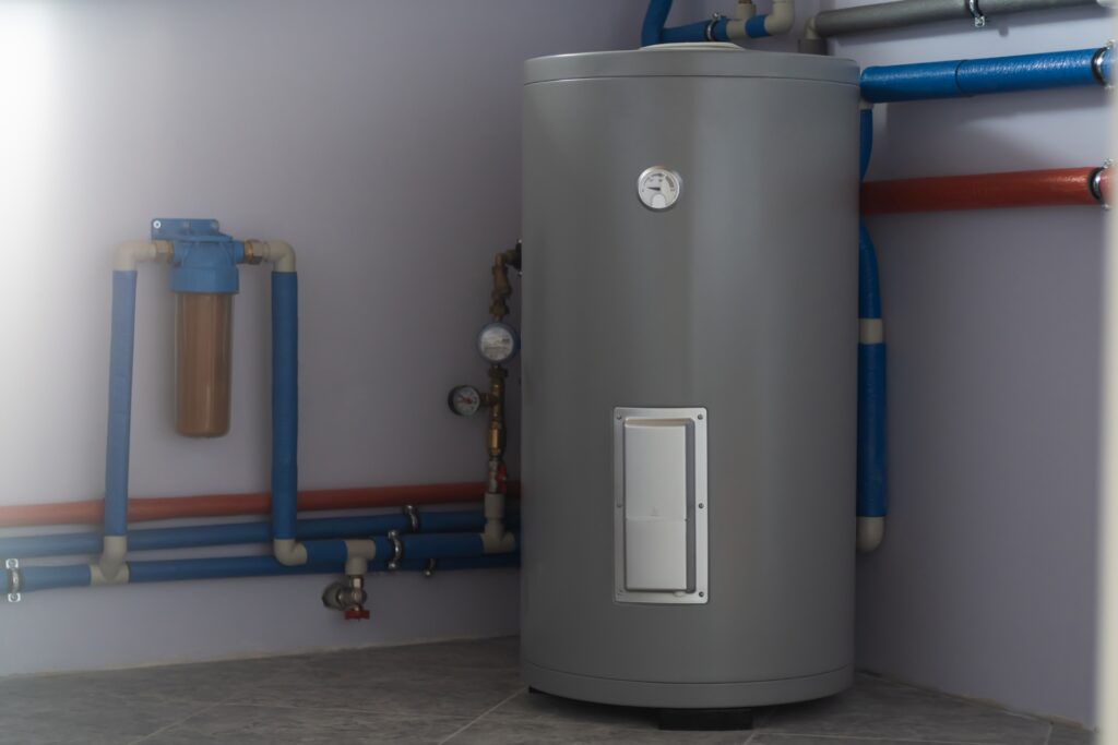  Tank for indirect heating of boiler, flow filter for cleaning, boiler piping and meters in boiler room of private house